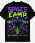 White graphic tee artwork featuring three aliens inside a flying saucer with planets, pizza, and cosmic accessories